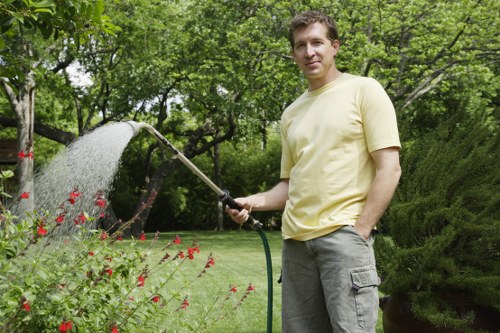 Supervisor checking completed garden work after a complaint